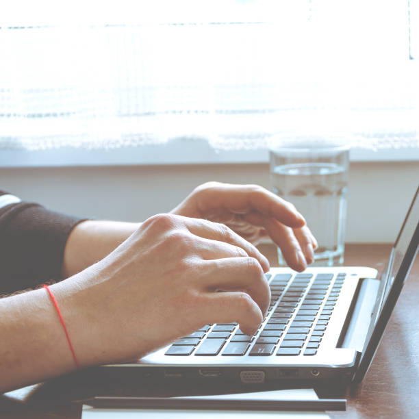 istock Freelancer's workplace at a table near the window. Home office 1302832660