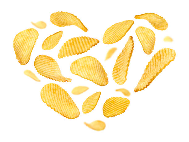 istock Fluted potato chips in the shape of a heart on a white background 1302834096