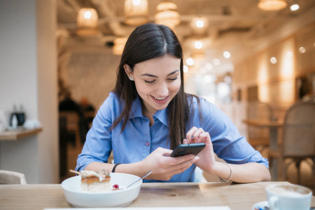istock Beautiful Caucasian woman treating herself with a cake 1302834764