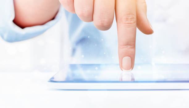 istock finger touch the screen of digital tablet 1302835141