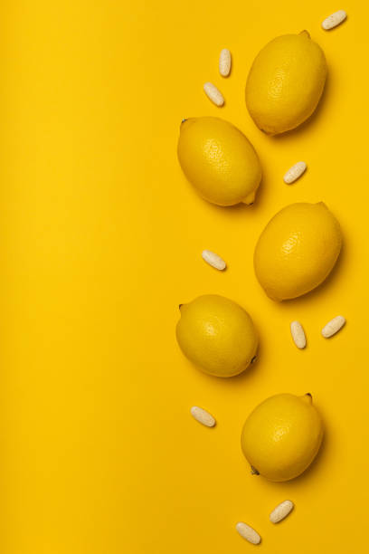 istock Vitamin C tablets and fruits 1302835391