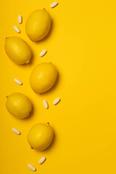 istock Vitamin C tablets and fruits 1302835392