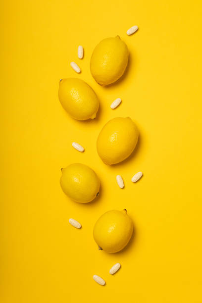 istock Vitamin C tablets and fruits 1302835422