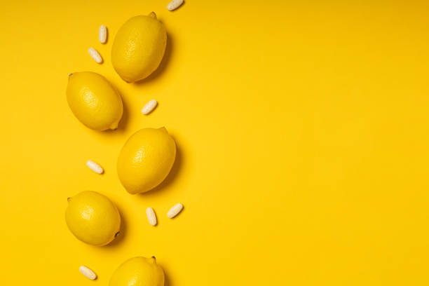 istock Vitamin C tablets and fruits 1302835956