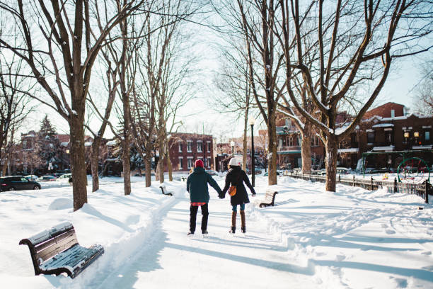 istock Young couple ice-skating on a ice rink 1302838037