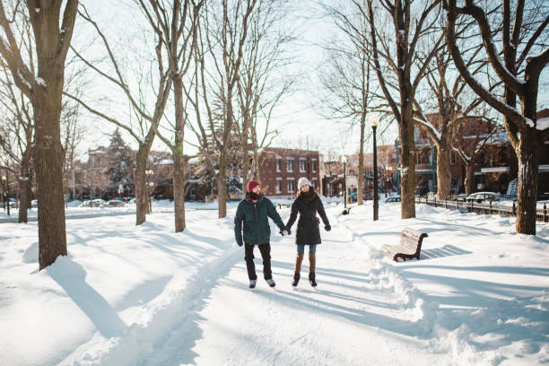 Young couple ice-skating on a ice rink