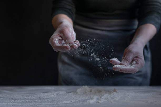 istock Woman baker with flour in her hands 1302838201