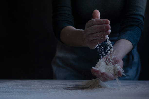 istock Woman baker with flour in her hands 1302838205