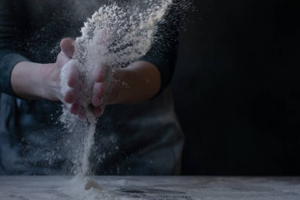 istock Woman baker with flour in her hands 1302838210