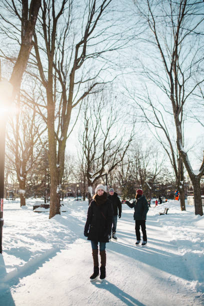 istock Three people ice-skating on a ice rink 1302838372