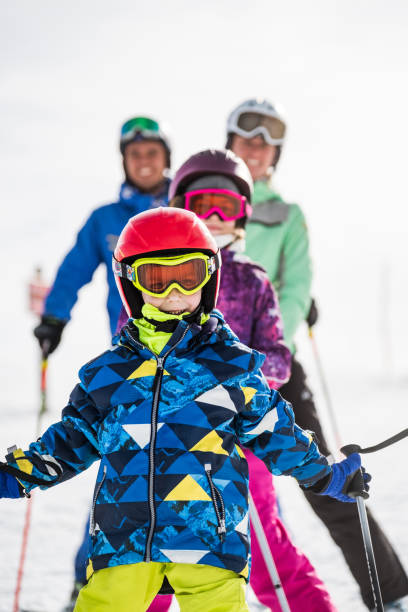 istock Family skiing together on winter day 1302840523