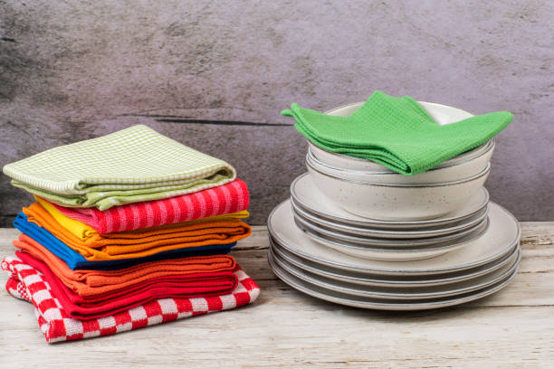 istock Kitchen towels with dishes on wooden table 1302841002