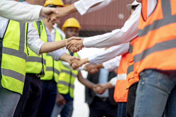 istock Architects shaking hand at construction site, Finishing successful meeting. 1302843087