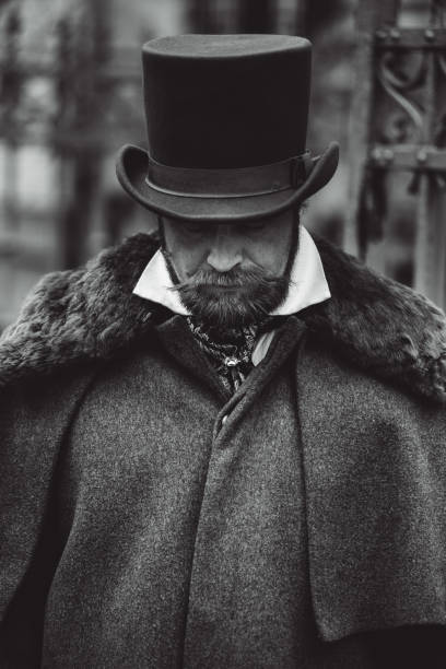 istock Respectable mustachioed man in classic retro clothes, coat and hat. 1302844588