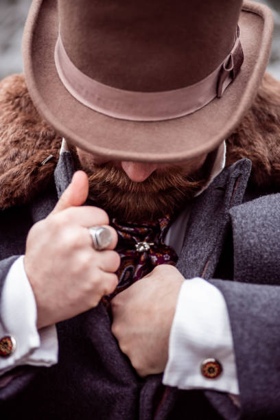 istock Respectable mustachioed man in classic retro clothes, coat and hat. 1302844606