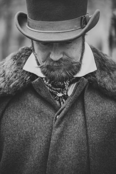istock Respectable mustachioed man in classic retro clothes, coat and hat. 1302844630