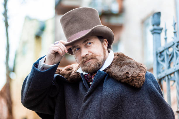 istock Respectable mustachioed man in classic retro clothes, coat and hat. 1302844753