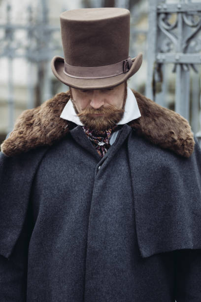 istock Respectable mustachioed man in classic retro clothes, coat and hat. 1302844873