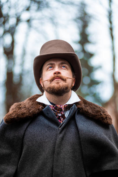 istock Respectable mustachioed man in classic retro clothes, coat and hat. 1302844991