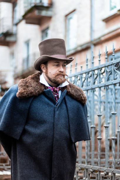 istock Respectable mustachioed man in classic retro clothes, coat and hat. 1302845004