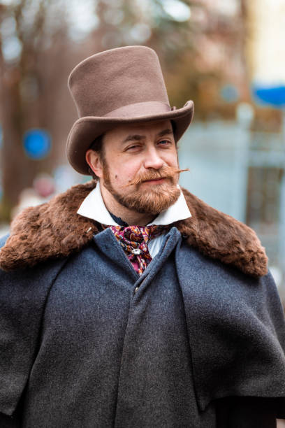 istock Respectable mustachioed man in classic retro clothes, coat and hat. 1302845082