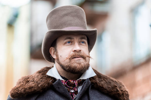 istock Respectable mustachioed man in classic retro clothes, coat and hat. 1302845100