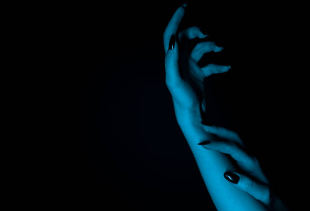 istock Mysterious woman hand silhouette. Space for your text. 1302846527