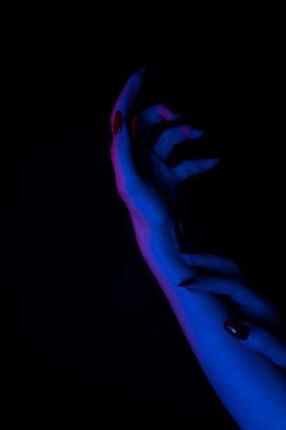 istock Mysterious woman hand silhouette. Space for your text. 1302846528