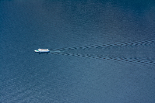 aerial ferry in the sea on a sunny day blue water isolated