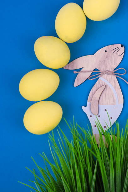 istock Easter holiday background. Pastel coloured decorated easter eggs on bridght background 1302847435