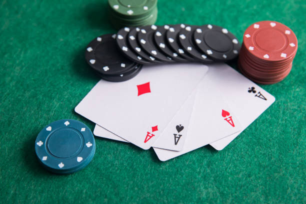 istock Pair of aces with poker chips 1302848957