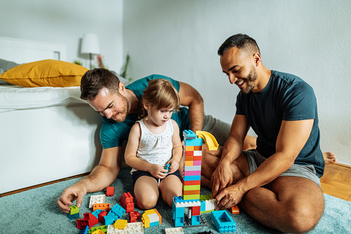 Gay couple adopted three year old girl and enjoying the parenthood