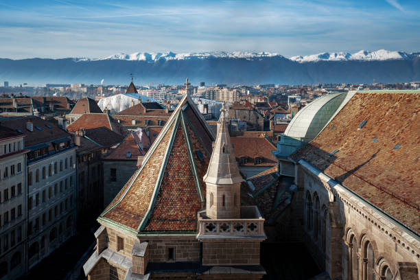 Aerial view of Geneva and St Pierre Cathedral with Alps Mountains on background - Geneva, Switzerland Aerial view of Geneva and St Pierre Cathedral with Alps Mountains on background - Geneva, Switzerland switzerland zurich architecture church stock pictures, royalty-free photos & images