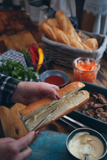 istock Preparing Vietnamese Banh Mi Sandwich 1302855442