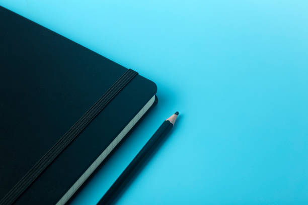 istock Notepad for sticky notes on the desktop. Office desktop, management and timing concept. 1302856376