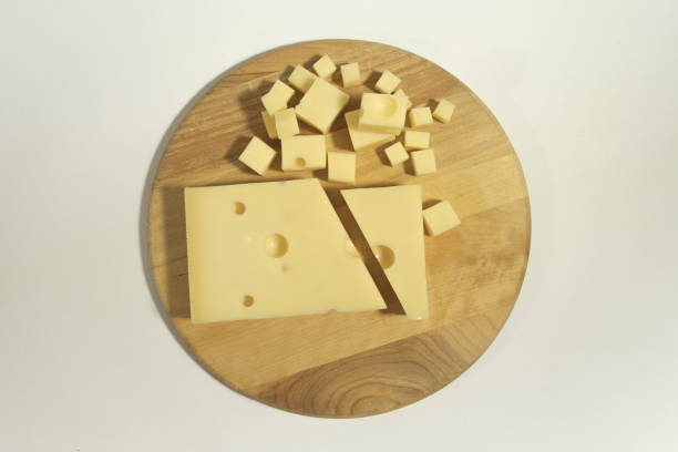 istock Emmental cheese close up on a cutting round board 03 1302856394