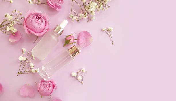 istock cream cosmetic rose flower on colored background 1302856667