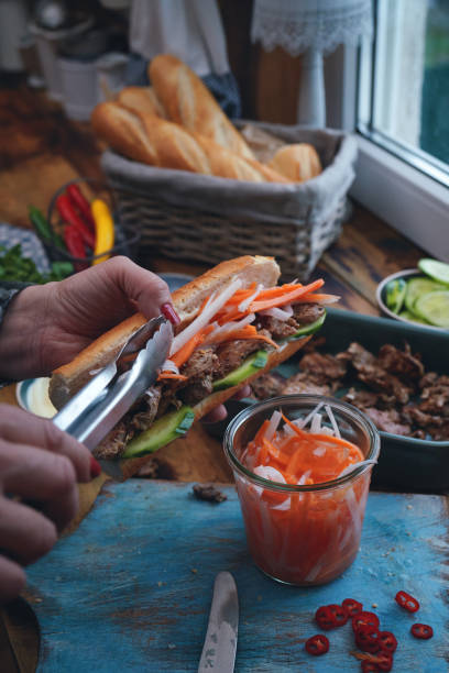 istock Preparing Vietnamese Banh Mi Sandwich 1302863376