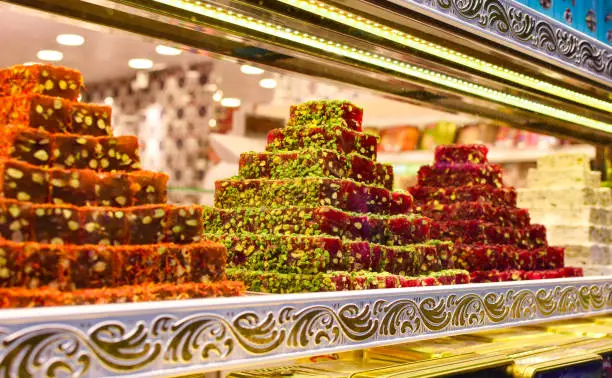 Photo of Traditional Turkish Ramadan dessert - lokum. Turkish delight on a stall. Edible souvenirs from Turkey.