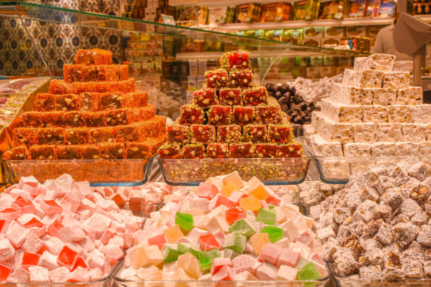 istock Traditional Turkish Ramadan dessert - lokum. Turkish delight on a stall. Edible souvenirs from Turkey. 1302865310