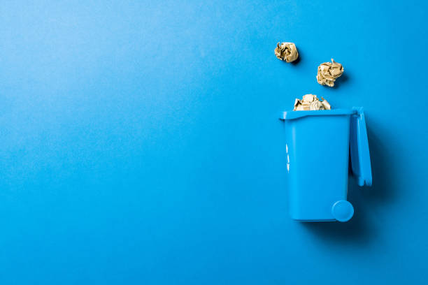 istock Recycling icon. Bin container for disposal garbage waste and save environment. Blue dustbin for recycle paper trash isolated on blue background. 1302865652