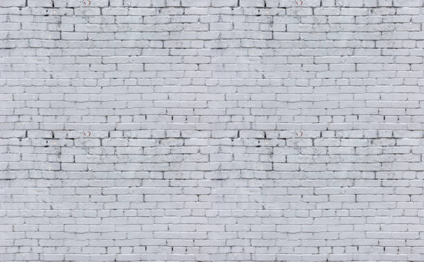 istock The seamless texture of the brick wall is white 1302867850