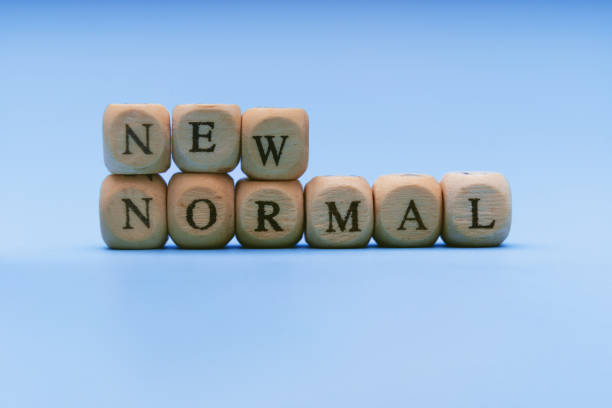istock New Normal. Text on Wooden Block. 1302870765