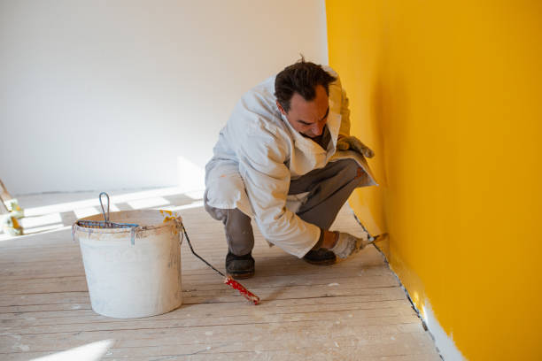 istock Wall painting in yellow color 1302873500