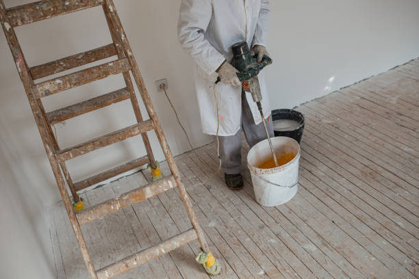 istock Top view of man mixing paint 1302874955