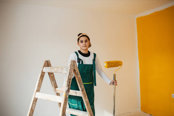 istock Boy stands on the ladder 1302876056