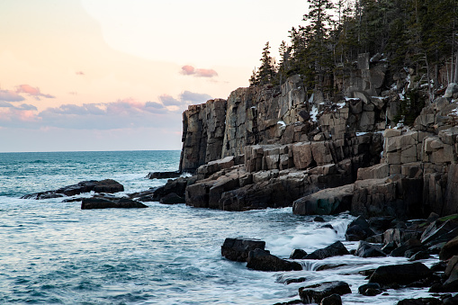 A winter landscape photo of Otter Cliffs in Acadia National Park in Maine United States