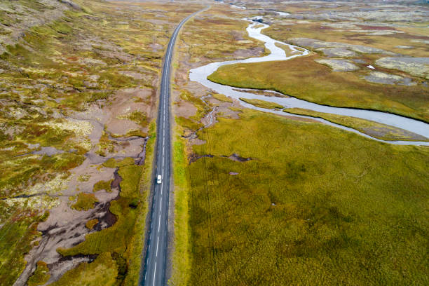 istock Road and river in Iceland, Aerial View 1302882847