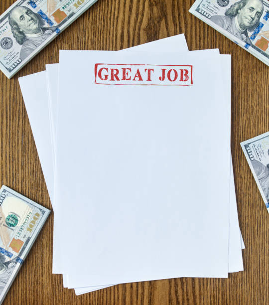 Great job stamp Looking down on a blank paper with “Great job” stamp and 100 dollar bills one hundred dollar stamp stock pictures, royalty-free photos & images