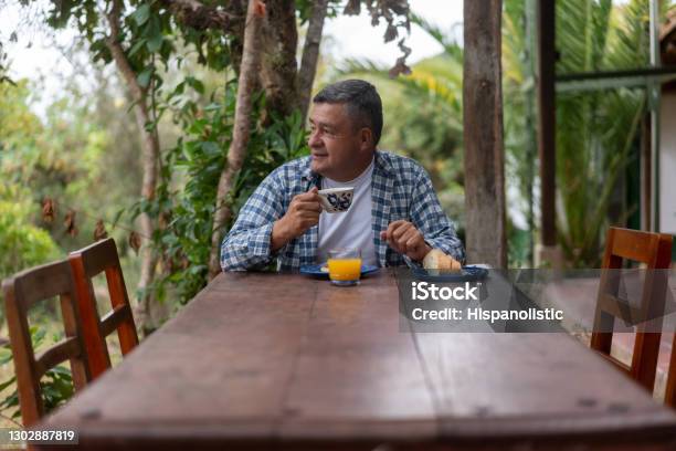 Adult Man At A Farm Having Breakfast At An Outdoors Dining Room Stock Photo - Download Image Now